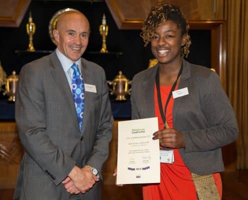 Fatima receives her career award from Adrian Belton of the CITB